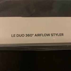 Black Lange Duo 360 Airflow Styler, hair clips and sea salt texturizing spray.